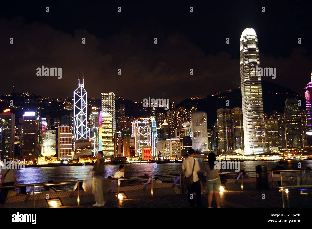 Tourists look at the Victoria Bay and Two ifc Tower (International Finance Centre Phase Two), tallest, and other skyscraphers and high office building Stock Photo