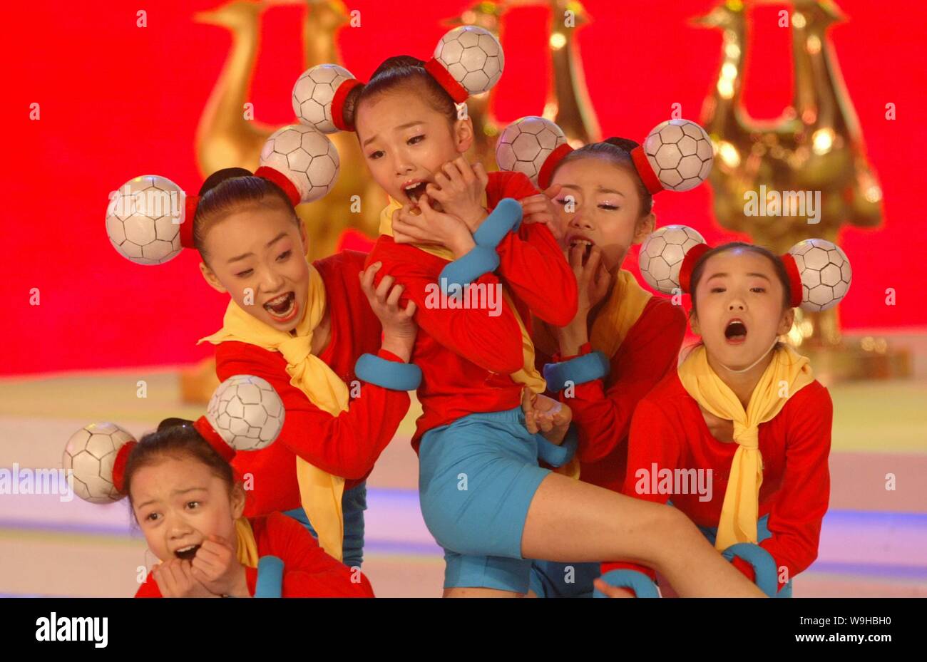 Young Chinese girls perform with soccer themed wear during the final draw for the 2007 FIFA Womens World Cup in Wuhan in central China Hubei province, Stock Photo