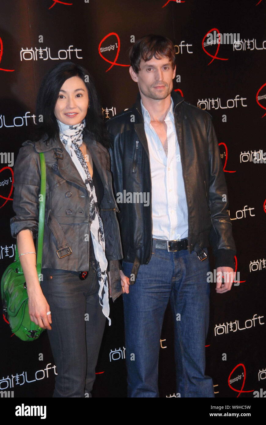 Hong Kong actress Maggie Cheung (L) and her boyfriend, Ole Scheeren, famous German architect, pose during a charity event in Shanghai, December 1, 200 Stock Photo