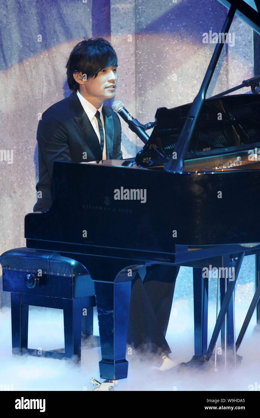 Taiwanese singer Jay Chow performs after winning the Best Original Film