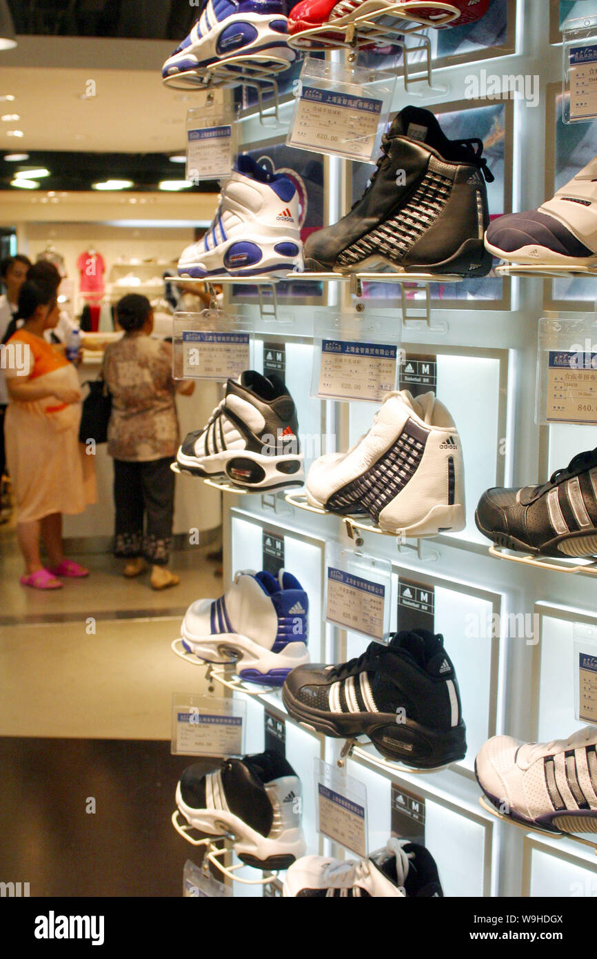 Adidas shoes are seen for sale at an Adidas boutique in Shanghai 2005 Stock  Photo - Alamy