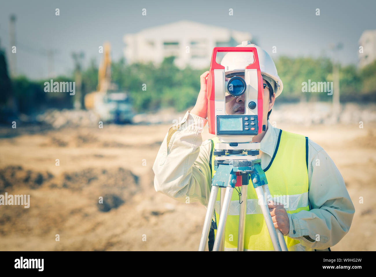 Civil engineer use surveyor equipment theodolite checking construction site for new Infrastructure project. photo concept for engineering work. Stock Photo