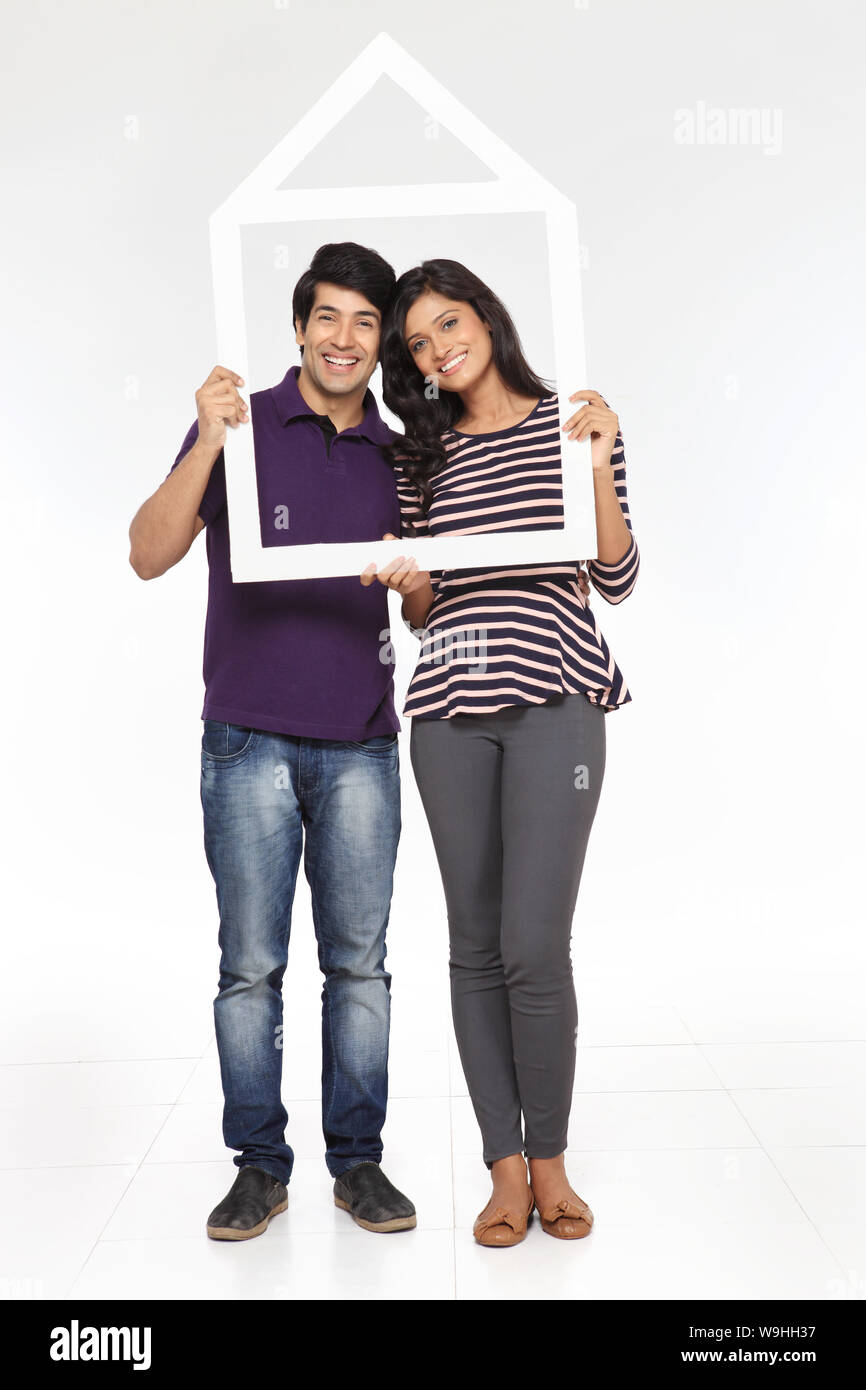 Young couple showing his dream home Stock Photo - Alamy
