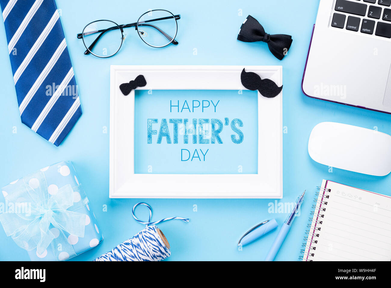 Happy Fathers Day Concept Top View Of Blue Tie Beautiful Gift Box Laptop Computer White Picture Frame With Happy Father S Day Text On Bright Blue Stock Photo Alamy