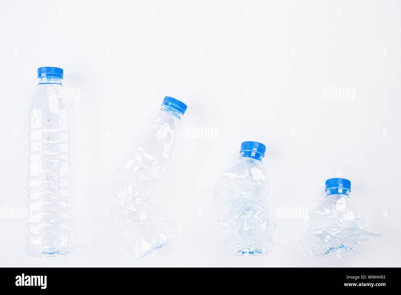 Download Top View Of Different Empty Plastic Water Bottles From Full To Crushed On White Background Recycle World Environment Day And Eco Concept Stock Photo Alamy