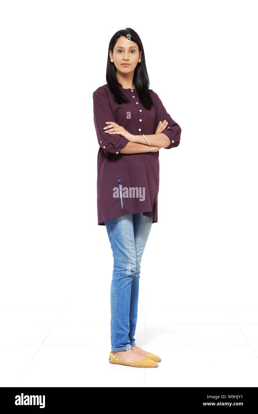Woman standing with her arms crossed Stock Photo - Alamy