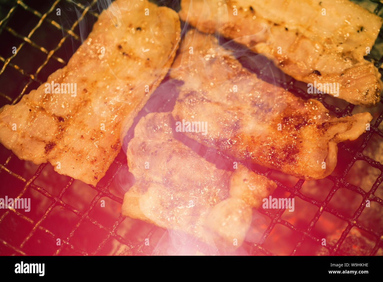 danger food burnt charred meat risk of cancer from heterocyclic amines (HCAs) and polycyclic aromatic hydrocarbons (PAHs). unhealthy food concept Stock Photo
