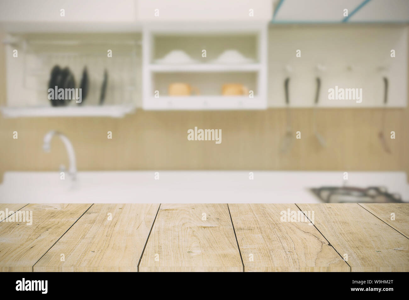 kitchen background with wooden table top in modern home vintage color tone Stock Photo