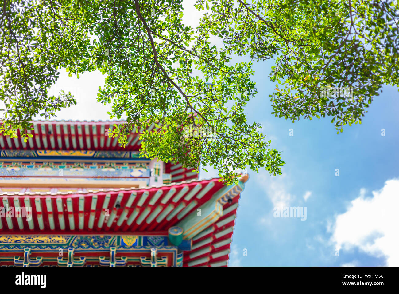 Chinese style temple roof with green day nature blue sky background Stock Photo