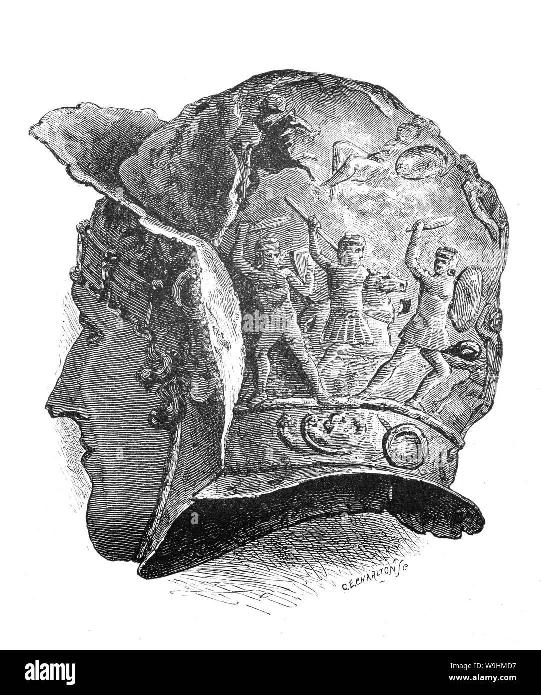 A 1st Century BCE votive helmet, an object displayed or deposited, without the intention of recovery or use, in a sacred place for in order to gain favor with supernatural forces.  High status artifacts such as armor and weaponry, fertility and cult symbols, coins, various treasures and animals (often dogs, oxen and in later periods horses) were common offerings in antiquity. Stock Photo