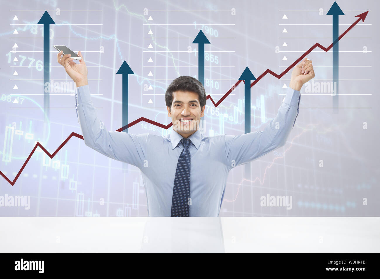 Businessman smiling in front of line graph rising upward Stock Photo ...