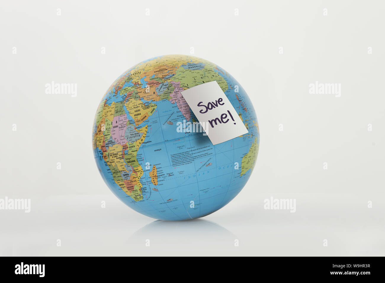 Adhesive note on globe Stock Photo