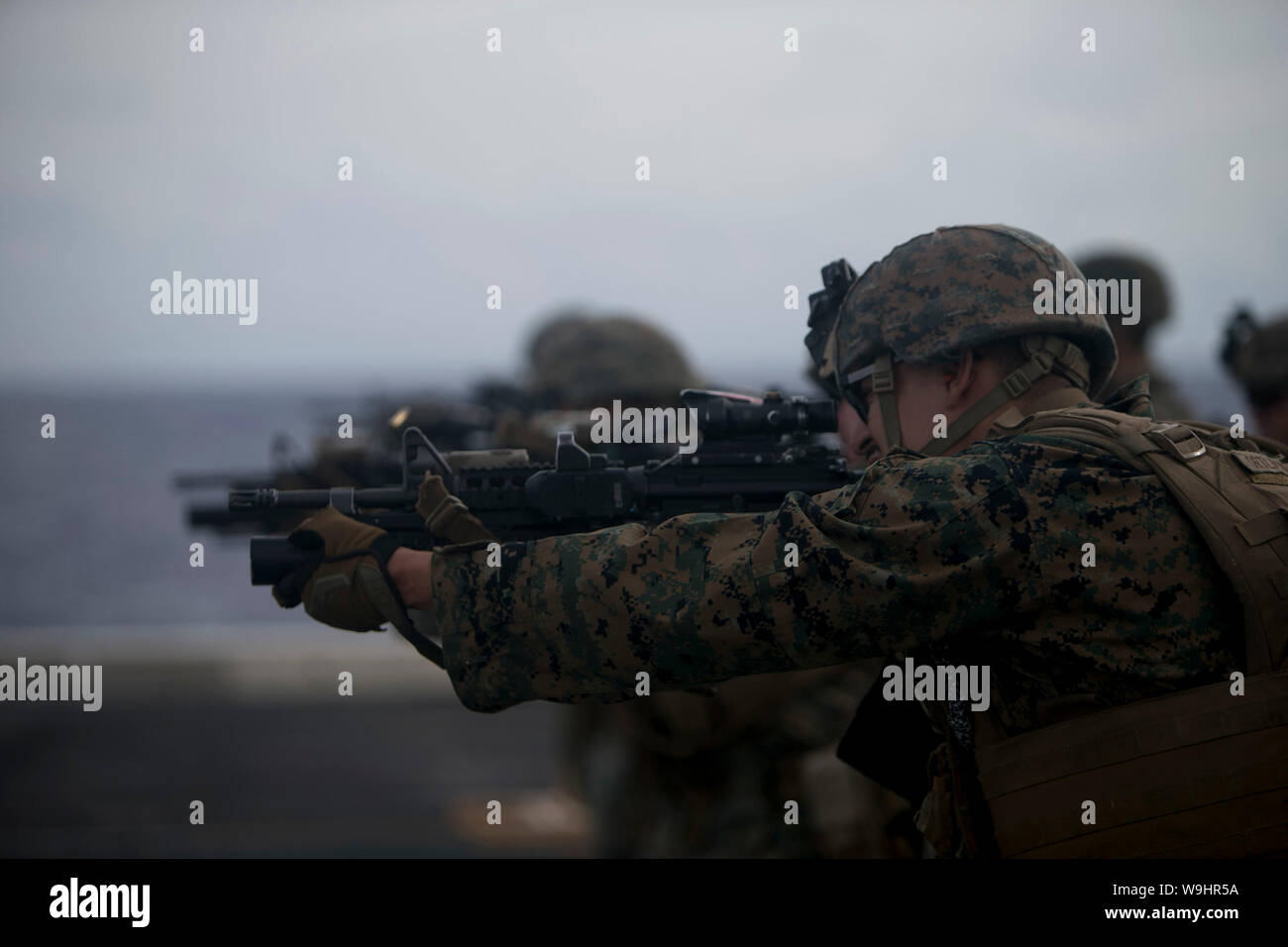 PHILIPPINE SEA (Aug. 9, 2019) Marines with Fox Company, Battalion Landing Team, 2nd Battalion, 1st Marines, 31st Marine Expeditionary Unit, fire M4A1 service rifles during a live-fire range aboard the amphibious transport dock USS Green Bay (LPD 20). Green Bay, part of the Wasp Amphibious Ready Group, with embarked 31st MEU, is operating in the Indo-Pacific region to enhance interoperability with partners and serve as a ready-response force for any type of contingency. (U.S. Marine Corps photo by Lance Cpl. Kyle P. Bunyi) Stock Photo