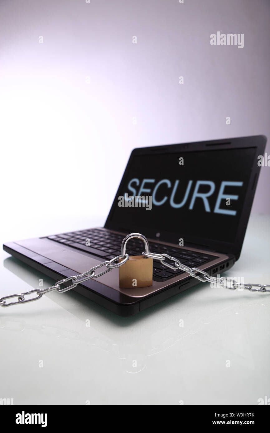 Chain and lock on laptop Stock Photo