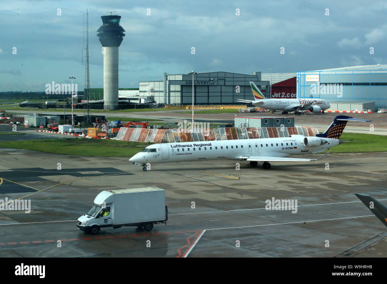 Lufthansa regional and Ethiopian Airlines planes at terminal one Manchester Airport Stock Photo