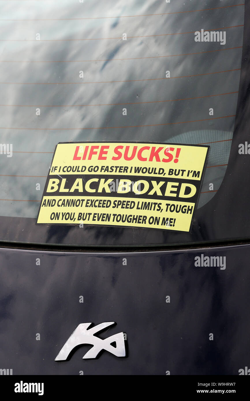 Silly car sticker unhappy about having a black box fitted to reduce the cars speed. Pictured in Bognor Regis, West Sussex, UK. Stock Photo