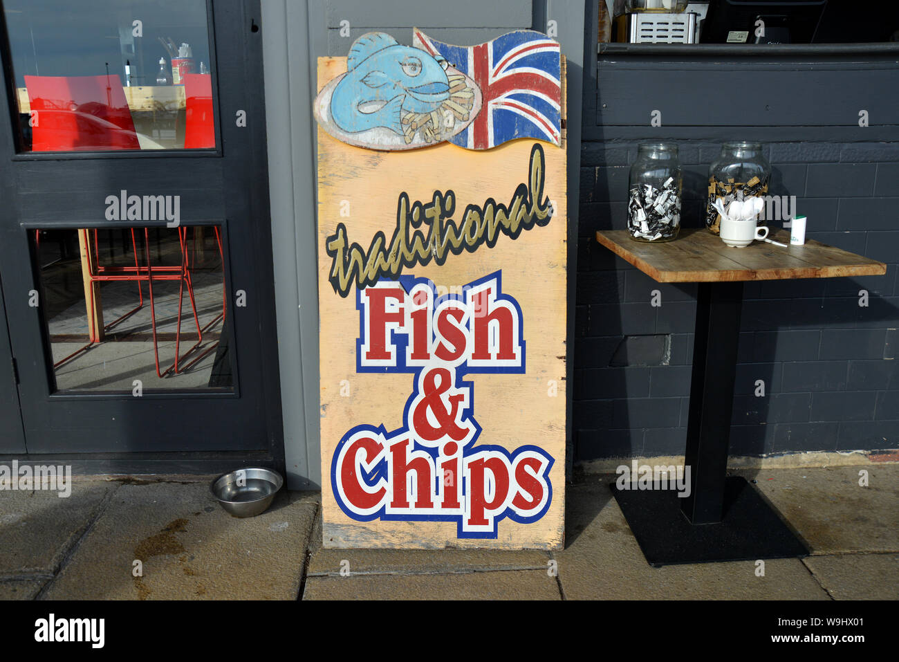 Traditional Fish and Chips sign outside a chip shop on the South of