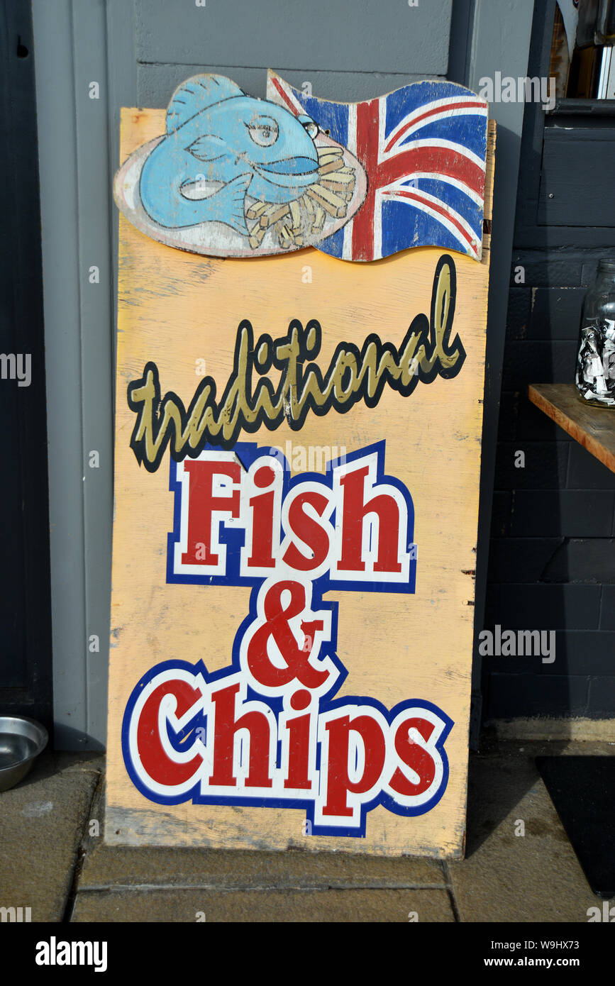 Traditional Fish and Chips sign outside a chip shop on the South of