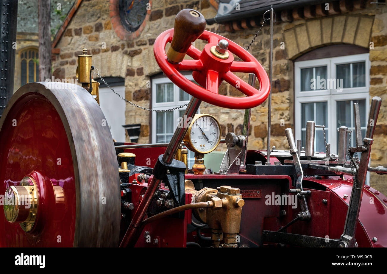 Parts of a steam engine in closeup showing the intricate details of
