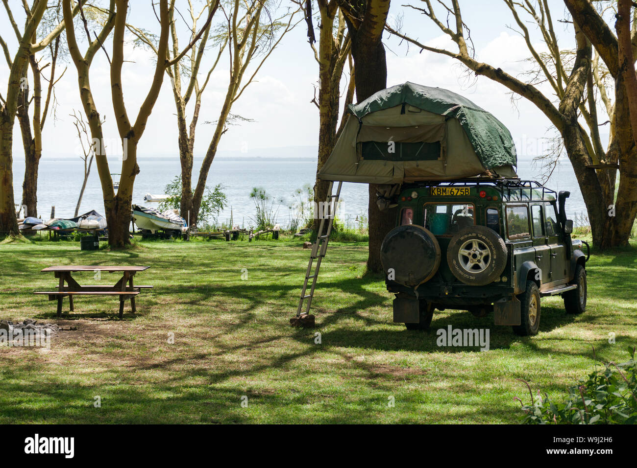 Roof tent on top of Toyota Landcruiser with lake Naivasha in background, Kenya, East Africa Stock Photo