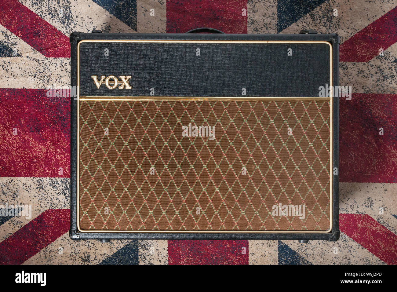 Carrara, Italy - August 14, 2019 - A vox amplifier (ac30) on a carpet with Union Jack flag. Vox amplifiers are the most used by guitarists who have ma Stock Photo