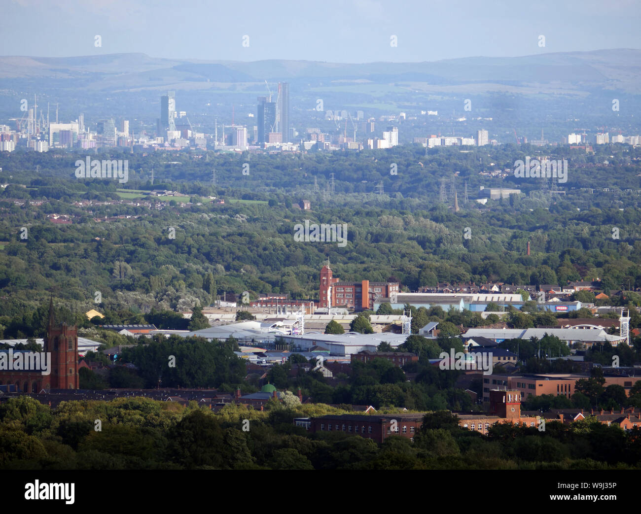 View looking over the town of Bolton with the city Manchester in the distance. photo DON TONGE Stock Photo