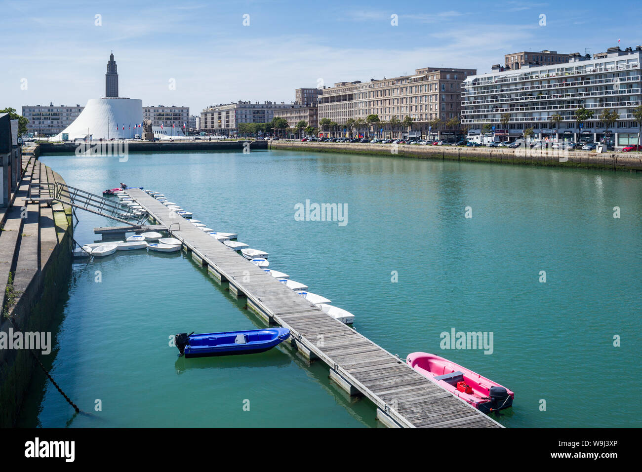 View over the Bassin du Commerce, Le Havre, Normandy, France with Le Volcan and St. Joseph's Church in the distance with a line of pleasure boats Stock Photo