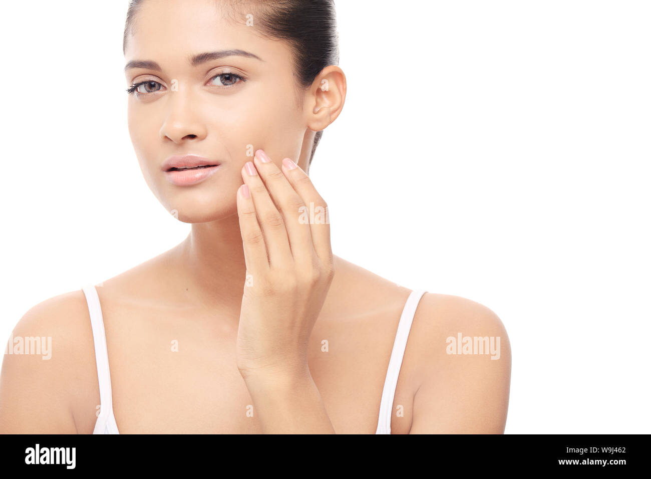 Young woman checking on her face Stock Photo - Alamy