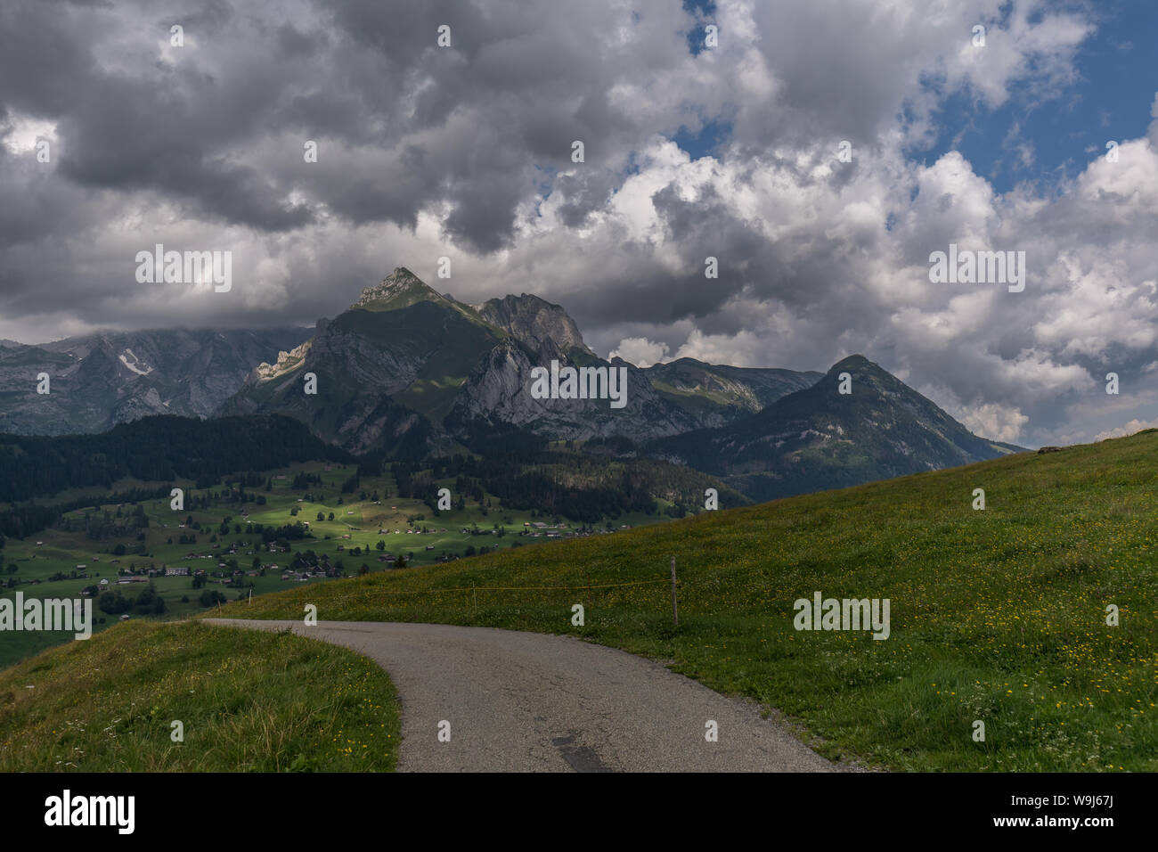 Hiking through swiss alps on a sunny day with blue sky near toggenburg ...