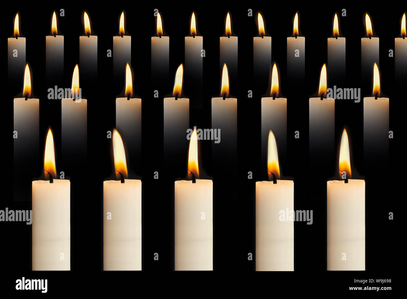 Christmas decoration with candles on a black background Stock Photo - Alamy