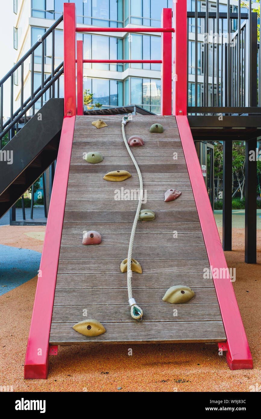 A shot of playground equipment with rock climbing features. Stock Photo