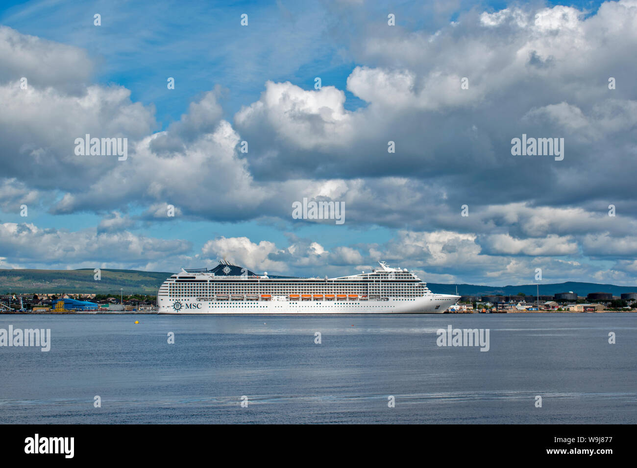 CROMARTY FIRTH ROSS AND CROMARTY SCOTLAND MSC ORCHESTRA CRUISE LINER LYING OFF INVERGORDON UNDER SUMMER SKIES Stock Photo