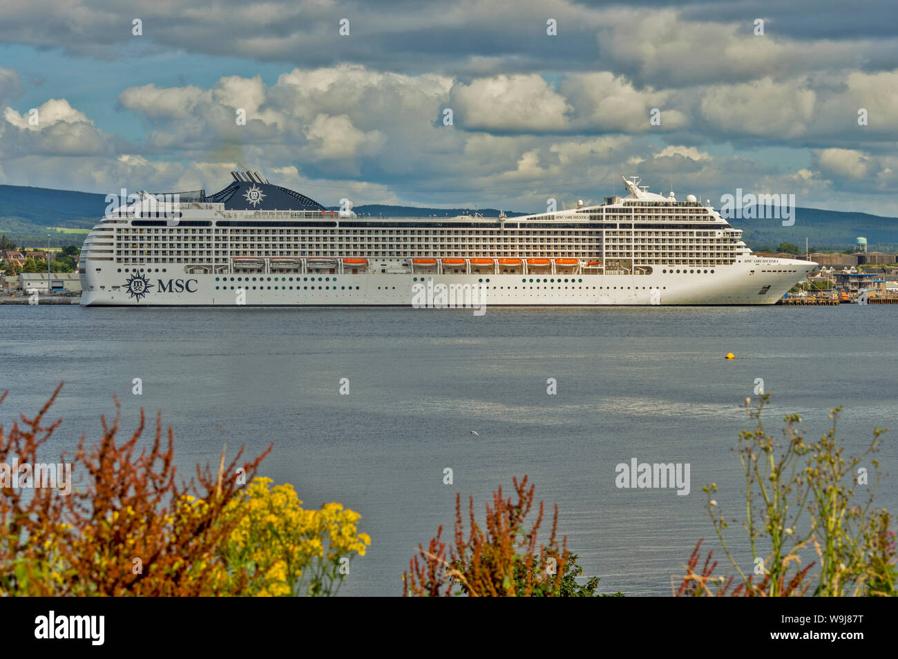 CROMARTY FIRTH SCOTLAND MSC ORCHESTRA CRUISE LINER LYING OFF INVERGORDON IN SUMMER Stock Photo