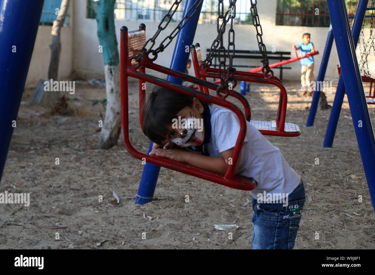 Khan Younis, Gaza Strip, Palestinian Territory. 13th Sep, 2019. Palestinian children play at a park during an event to celebrate Eid al-Adha festival, in Khan Younis in the southern Gaza Strip, August 13, 2019 Credit: Mariam Dagga/APA Images/ZUMA Wire/Alamy Live News Stock Photo