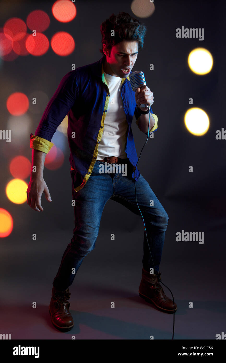 Smiling into microphone hi-res stock photography and images - Alamy