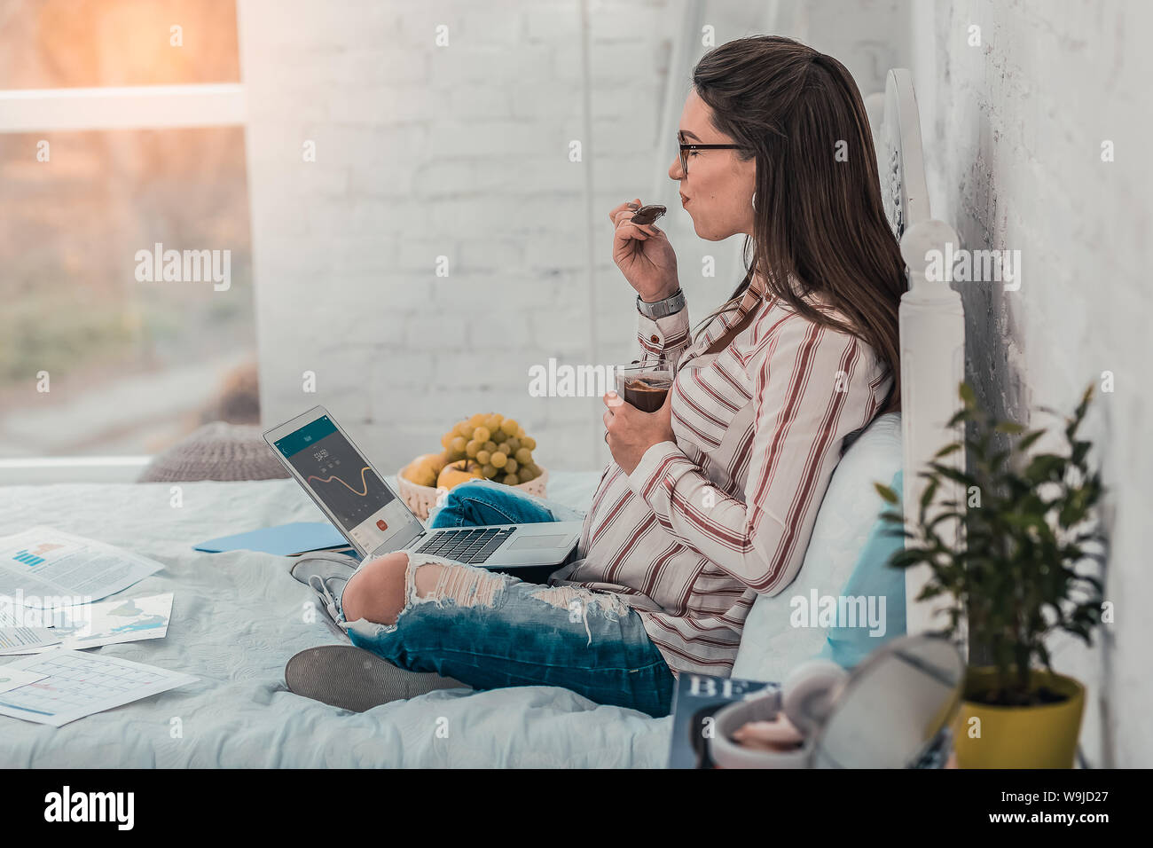 Dreamy pregnant female person enjoying chocolate mousse Stock Photo Alamy