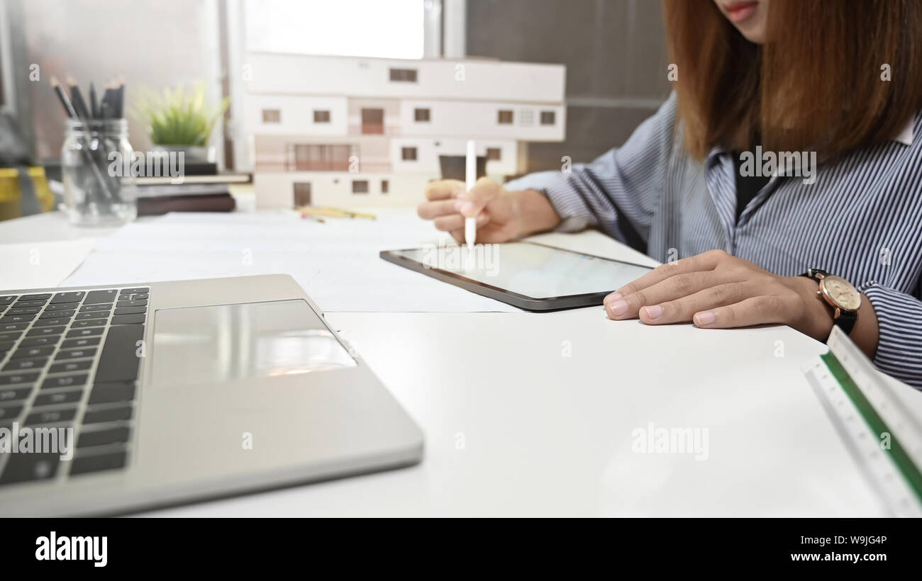 Architect female working digital tablet drawing architecture project