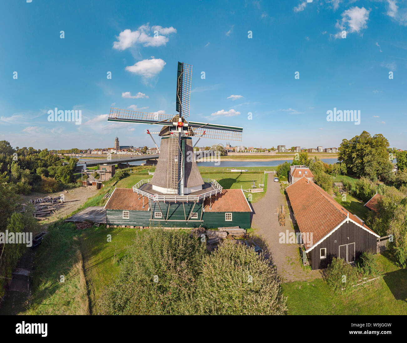 Saw mill called De Bolwerksmolen and the Lebuinus church, Deventer,   Overijssel, , Netherlands, 30071265 *** Local Caption *** windmill, city, villag Stock Photo