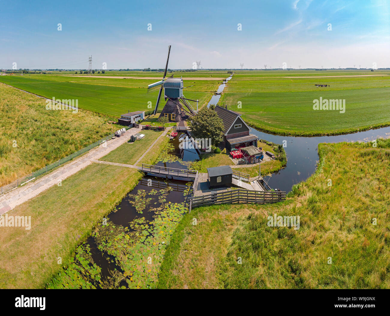 Hollow post mill called Achthovense Molen, Leiderdorp,   Zuid-Holland, , Netherlands, 30071398 *** Local Caption *** windmill, field, meadow, spring, Stock Photo