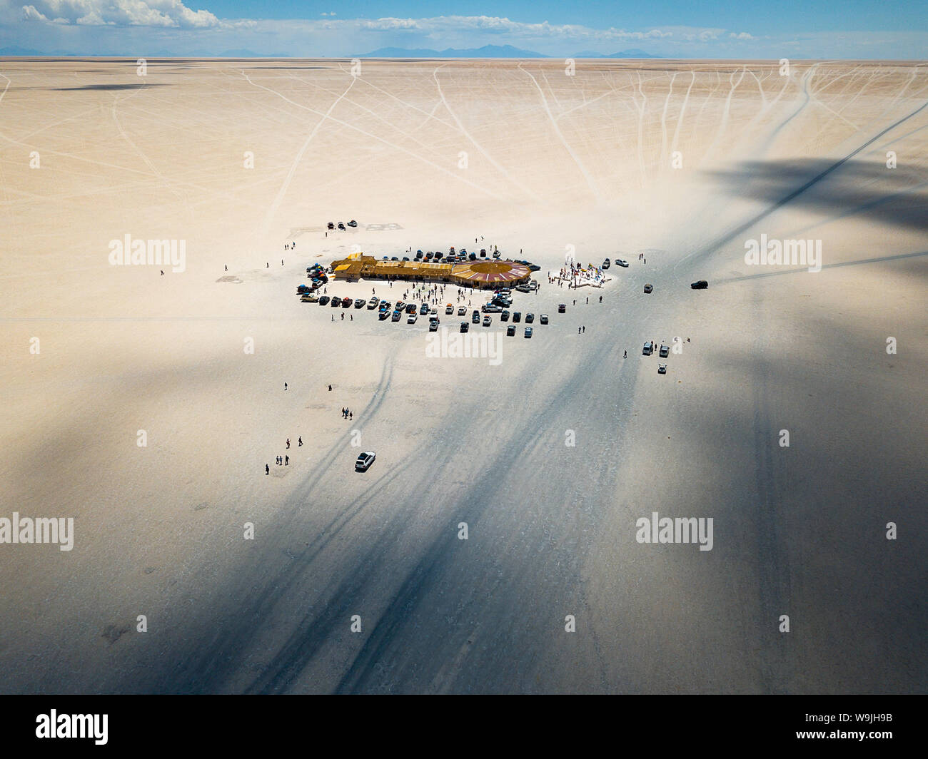 Aerial of a lodge and cars in the salt flats of Uyuni in Bolivia Stock Photo
