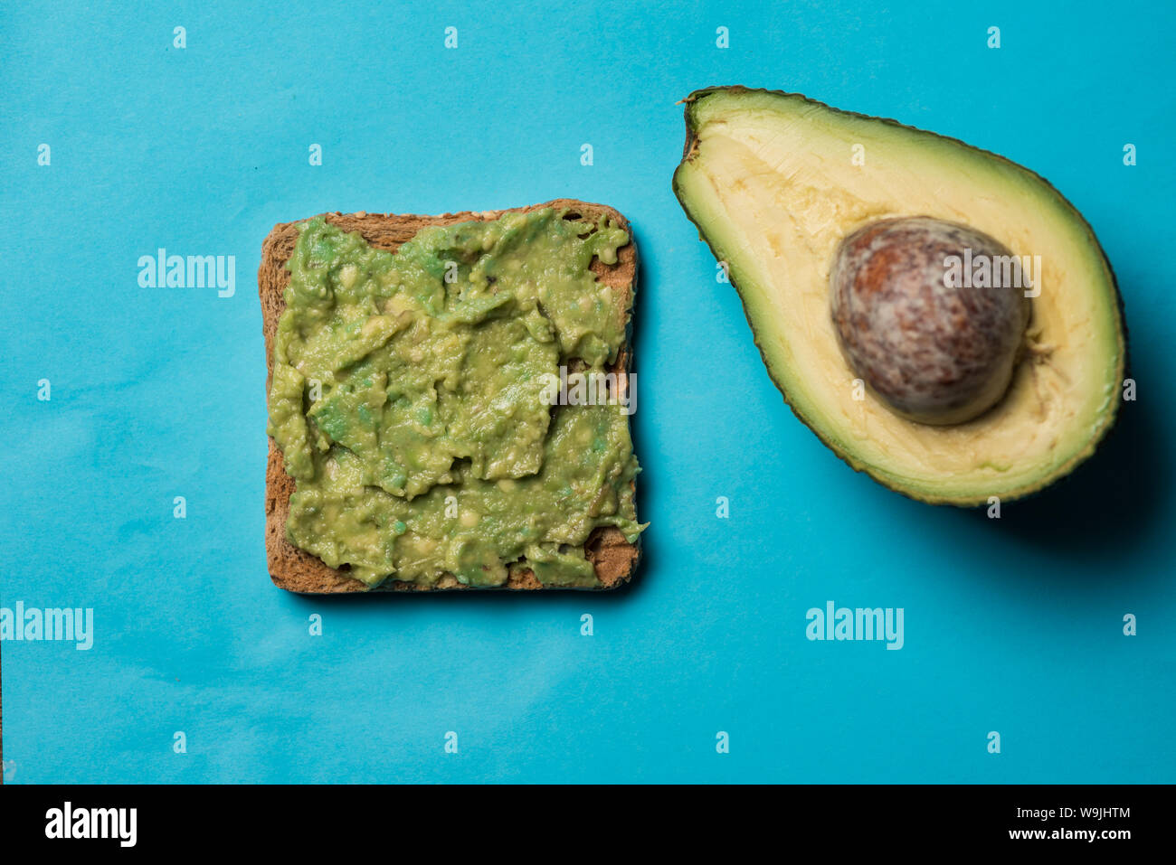 Freshly cut avocado on clean surface Stock Photo Alamy