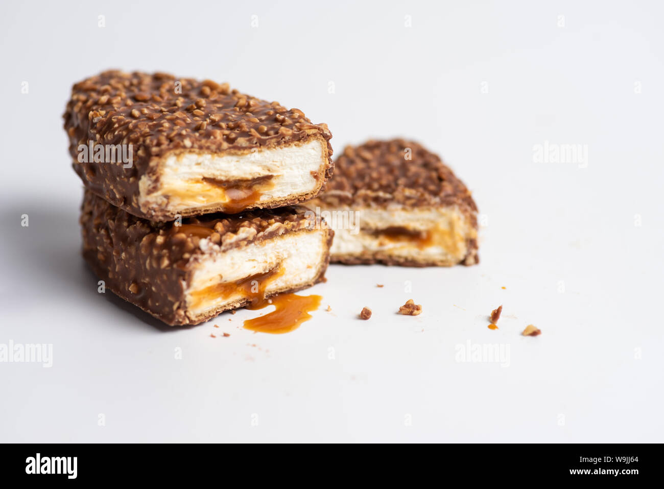 Chocolate bars with crushed peanuts and caramel stuffing Stock Photo