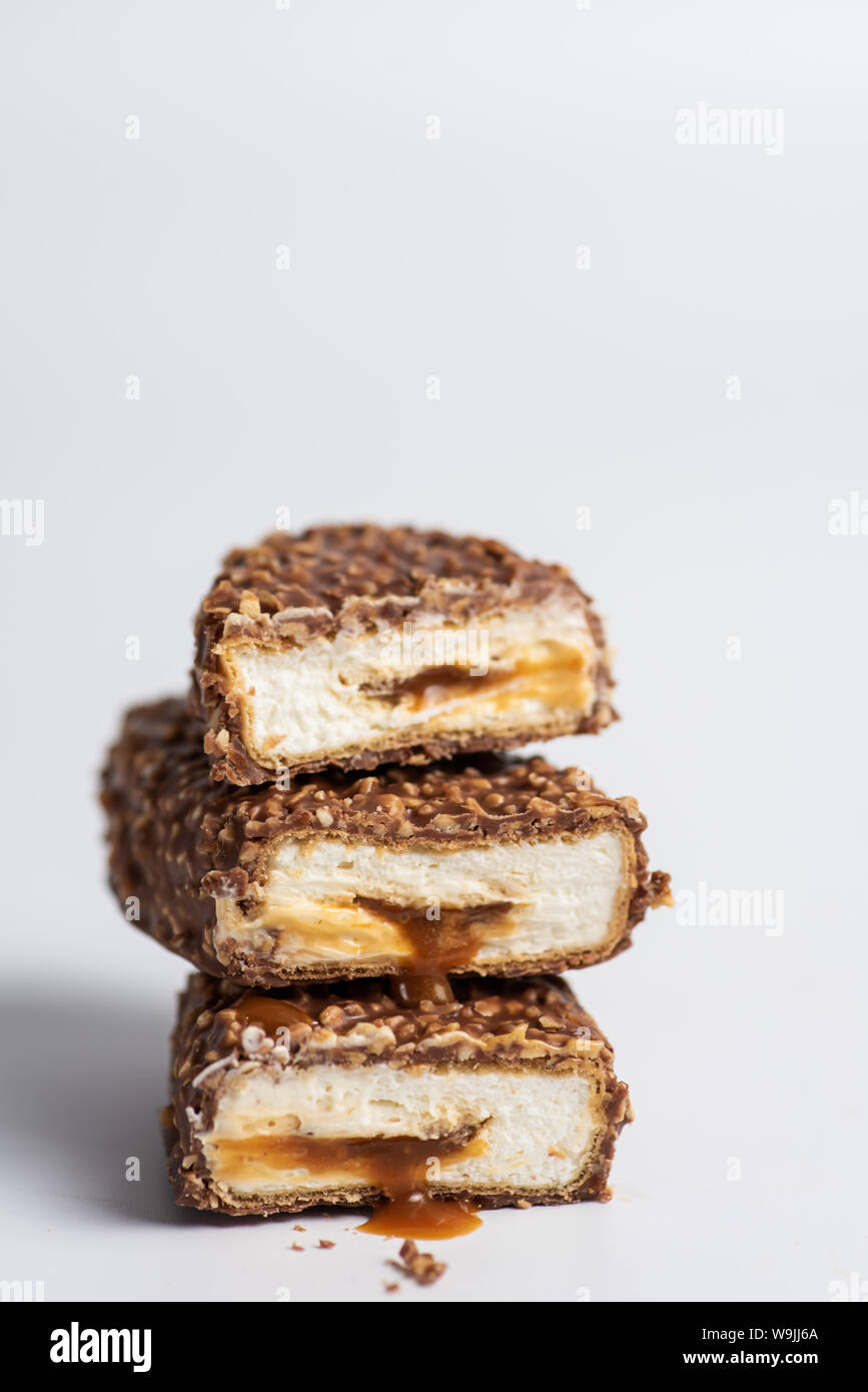 Chocolate bars with crushed peanuts and caramel stuffing Stock Photo