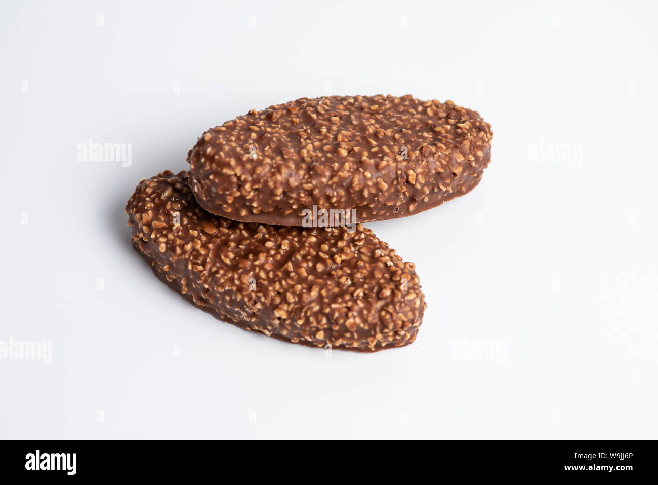 Chocolate bars with crushed peanuts and caramel stuffing Stock Photo