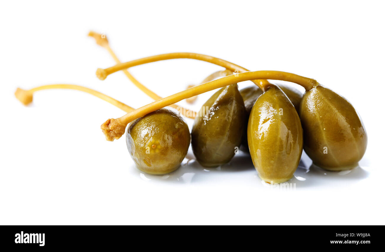 Pickled caper berries isolated on white background . Edible fruits of