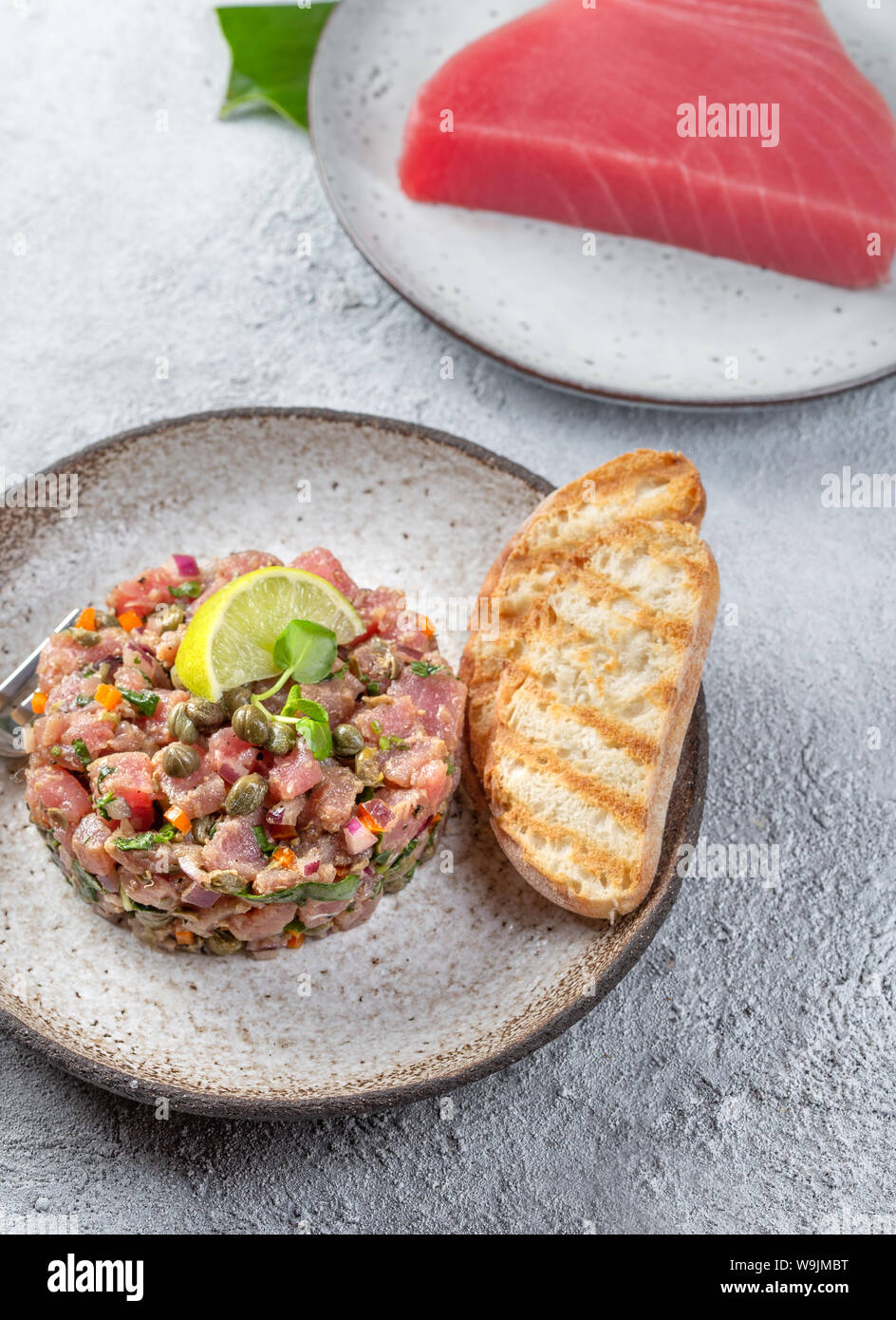 Tuna fish TARTAR tartare on gray plate Stock Photo Alamy