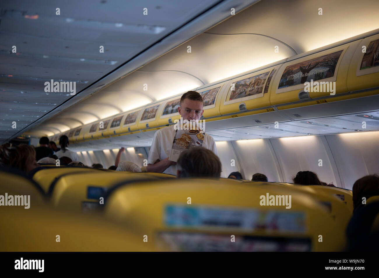 Ryanair steward selling wares, aircraft interior, Dublin Airport, Swords, Dublin, Ireland, Europe Stock Photo