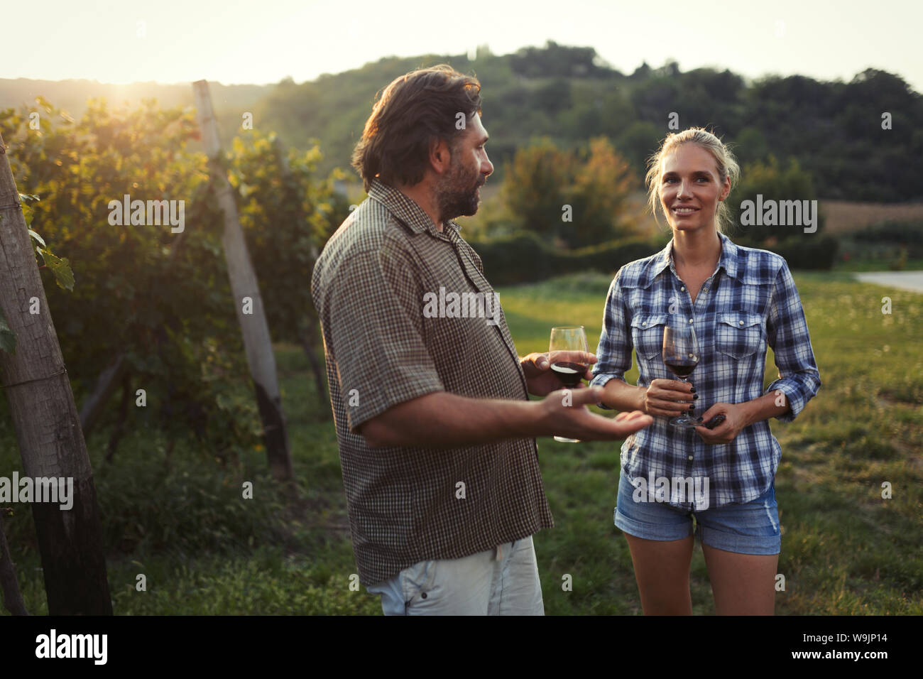Picture of people tasting red wine in vineyard Stock Photo - Alamy