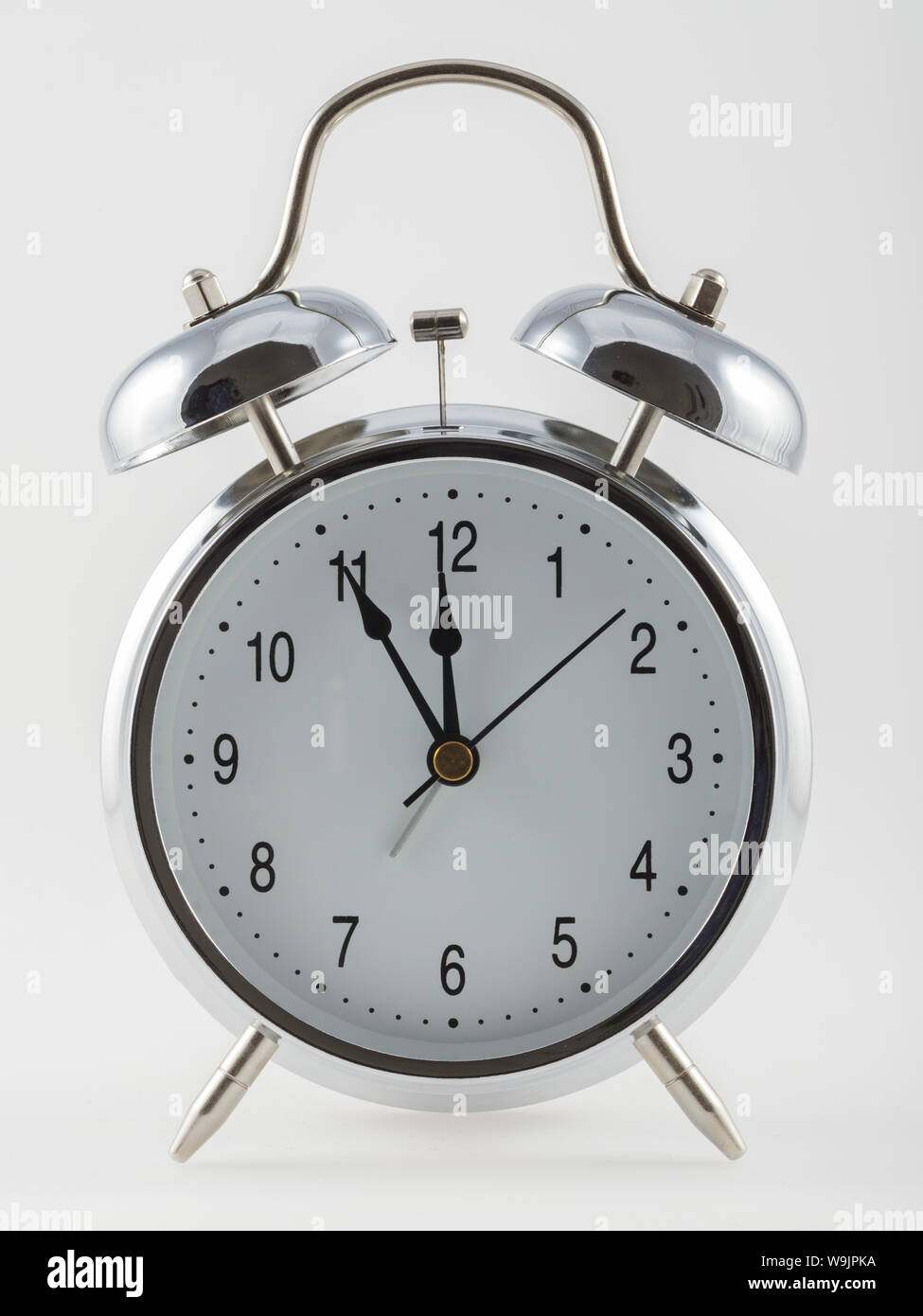 Vintage alarm clock isolated on white background Stock Photo - Alamy
