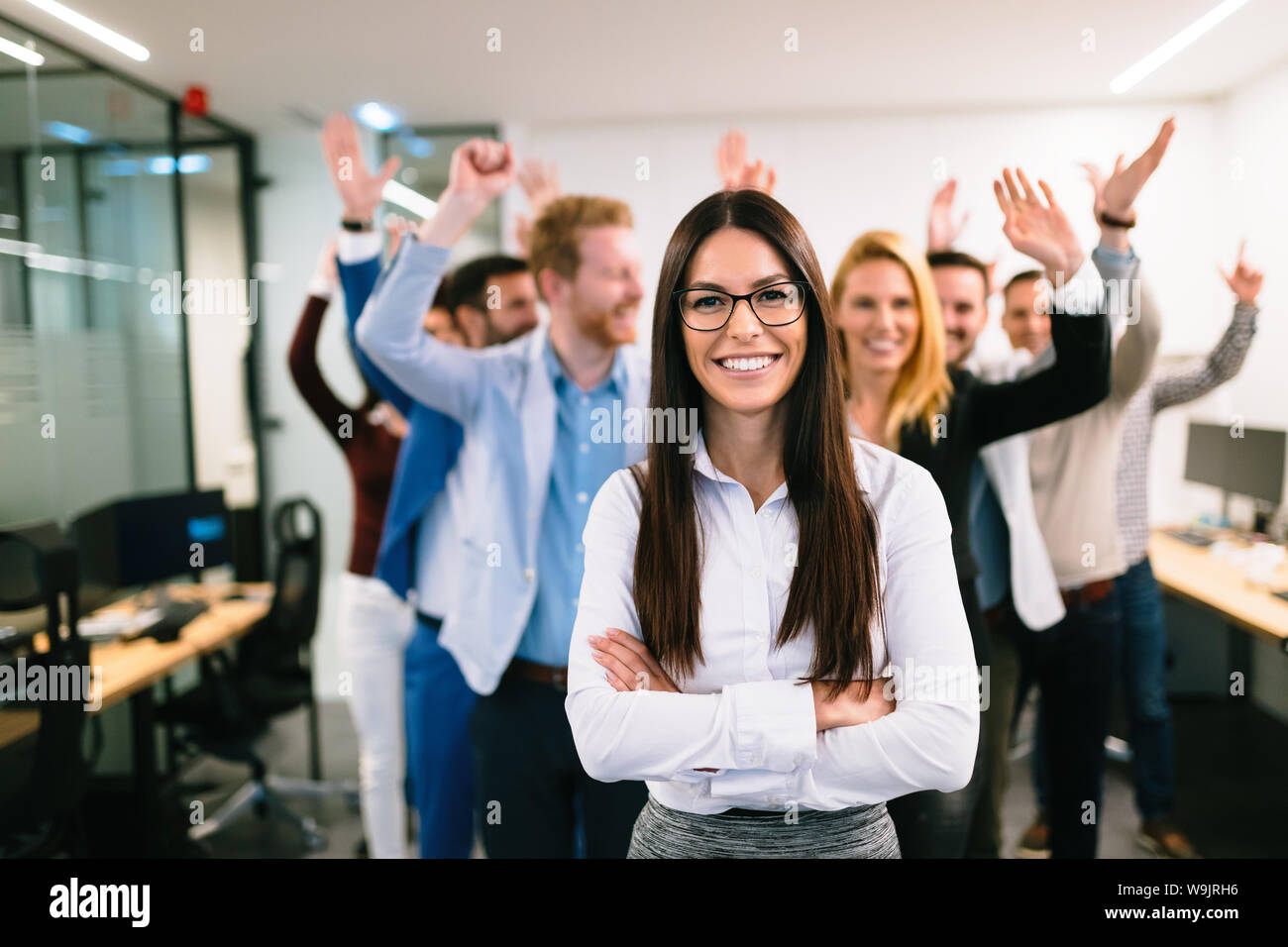 Portrait of business team posing in office Stock Photo - Alamy